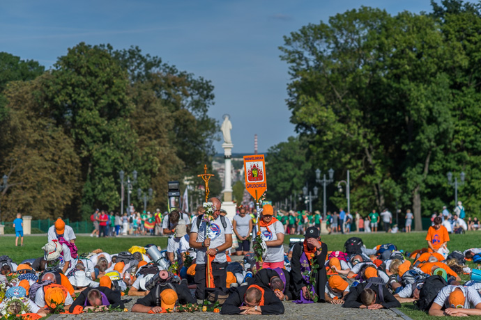 Celebration of Maria ascension in Jasna Góra, Poland 2018. Pilgrims honour God and the priests by kneeling in front of the monastery or lying on their stomachs on the ground. Image: Michel Meijer