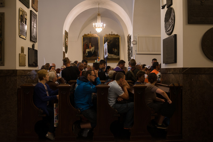 Celebration of Maria ascension in Jasna Góra, Poland 2018. Pilgrims wait and pray in the chapel where the painting of the Black Madonna hangs. Image: Michel Meijer