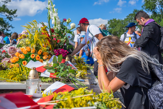 Celebration of Maria ascension in Jasna Góra, Poland 2018. A woman kneels and prays in front of the sanctuary of Jasna Góra. Image: Michel Meijer