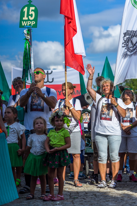 Celebration of Maria ascension in Jasna Góra, Poland 2018. A group of pilgrims greet the priest on the balcony of the Jasna Góra pilgrimage site. Image: Michel Meijer