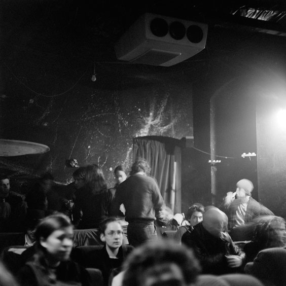 Tuesday, February 4, 2003. Durchsfenster - The February program 2003 The visitors are looking for a place in the cinema's projection room, in which the beamer is explicitly visible from the ceiling. Image: Michel