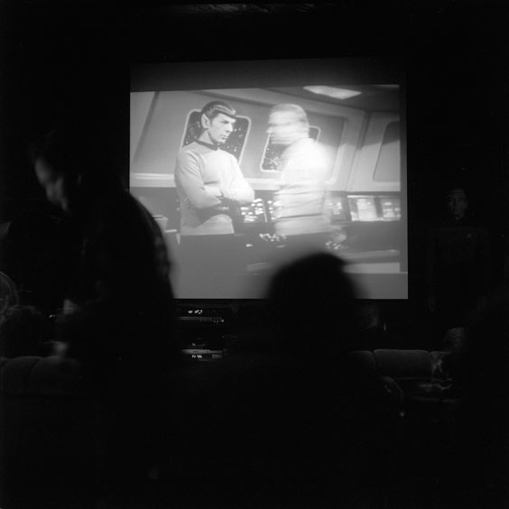 Monday, February 17, 2003. Durchsfenster - The February program 2003 The audience seeks a seat in the cinema while an episode of Star Trek begins on the screen. Image: Michel Meijer