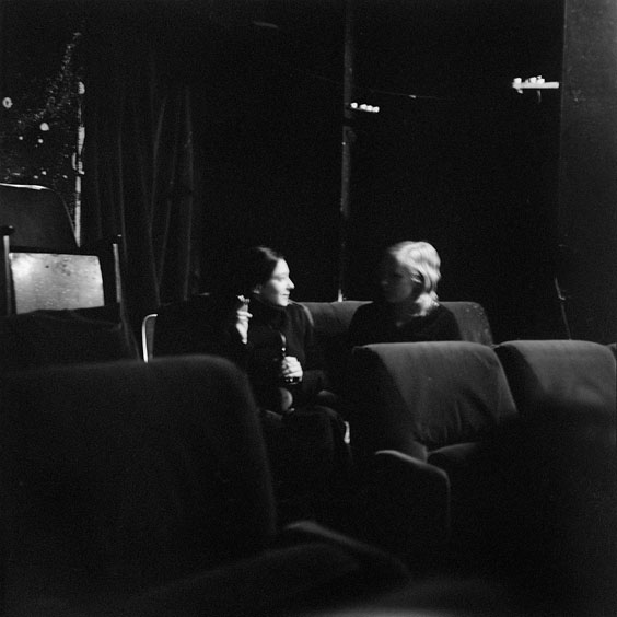 Tuesday, February 25, 2003. Durchsfenster - The February program 2003 Two visitors talk about the film in the cinema with beer and cigarettes. Image: Michel Meijer