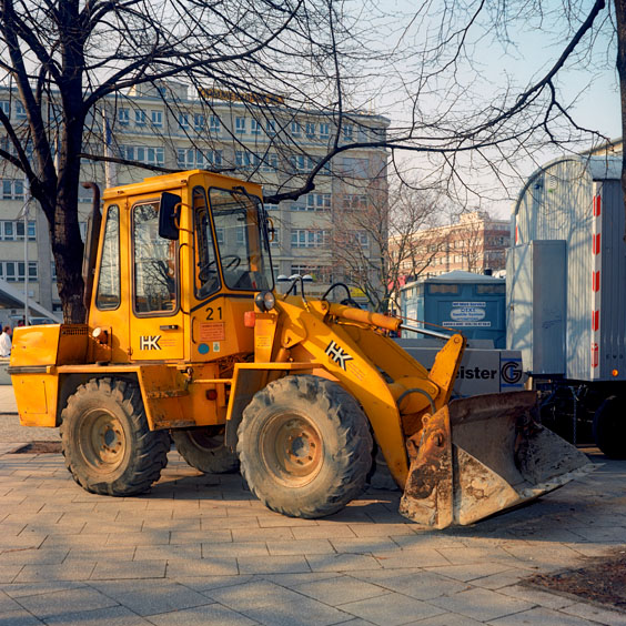 A yellow bulldozer on a construction site in a Berlin street. Image: Michel Meijer