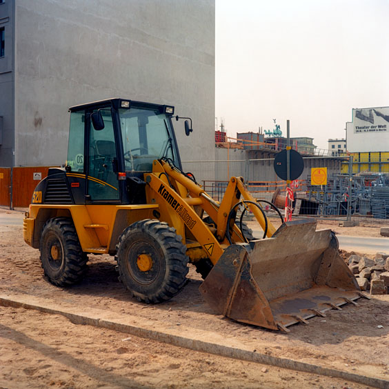A yellow bulldozer on a construction site in a Berlin street. Image: Michel Meijer