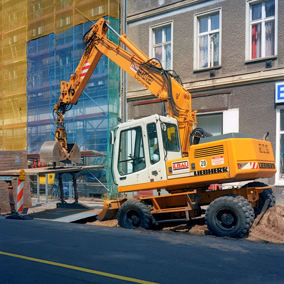 A yellow excavator in a street in Berlin. Image: Michel Meijer