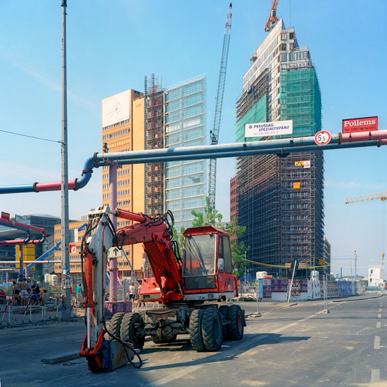A red excavator in a street in Berlin. Image: Michel Meijer