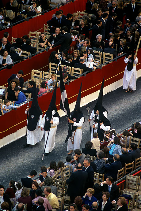 The various church communities walk in procession across the town hall square. Here, rich and/or distinguished people sit. Image: Michel Meijer